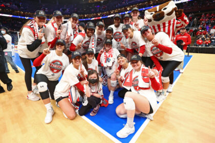 University of Wisconsin women's volleyball players return to the court a day after topless locker room photos were leaked online as they put scandal behind them with win amid police probe